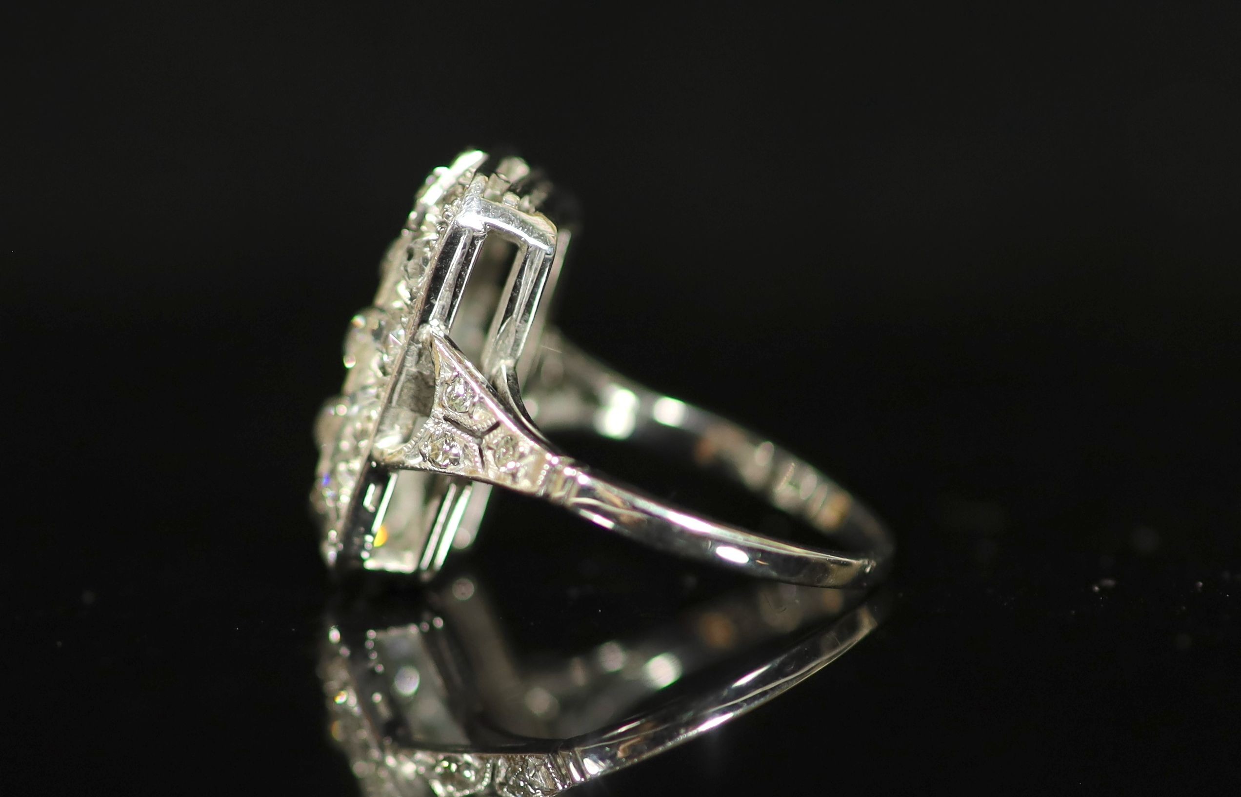 A 1930's/1940's white gold? and diamond cluster tablet ring
